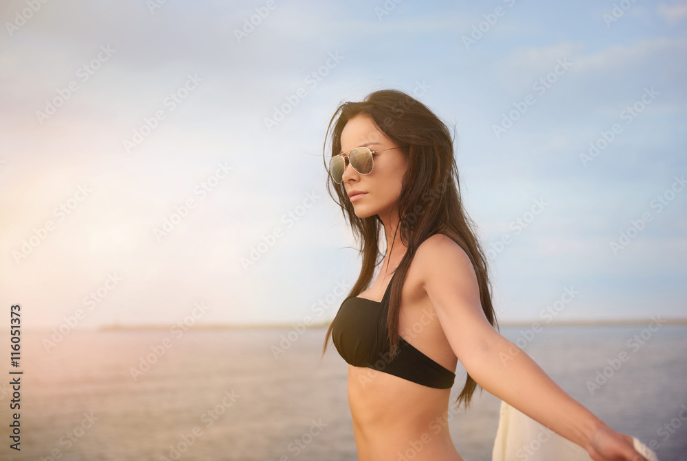 Side view of woman by the sea Side view of woman by the sea