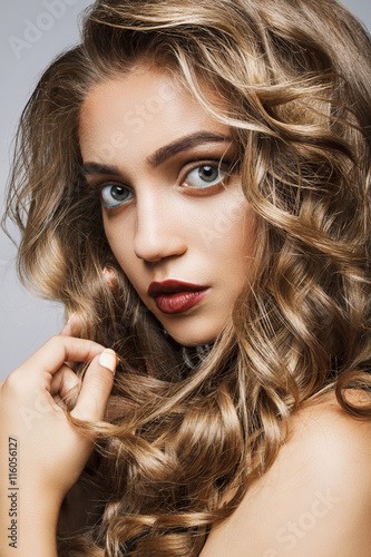 Tablou pe pânză Beautiful girl with long wavy hair . fair-haired model with curl