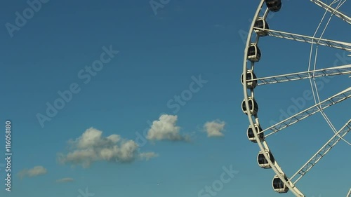 Big ferris wheel on blue sky background