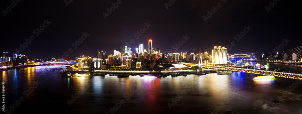 cityscape and skyline of downtown near water of chongqing at nig