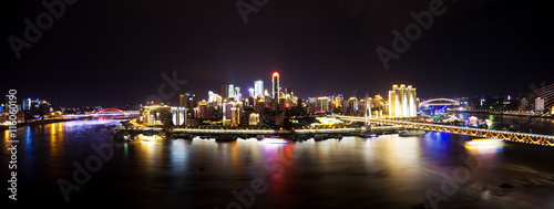 cityscape and skyline of downtown near water of chongqing at nig