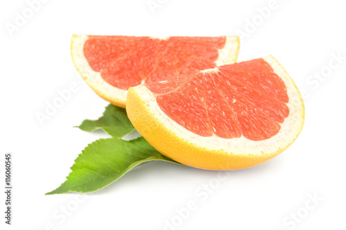 two slices of grapefruit isolated on white background