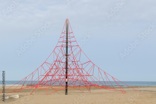 rope pyramid for children to play on a beach in the Mediterranea