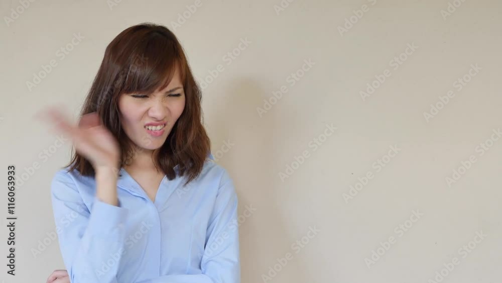 woman smelling bad smell, covering her nose woman smelling bad smell, covering her nose