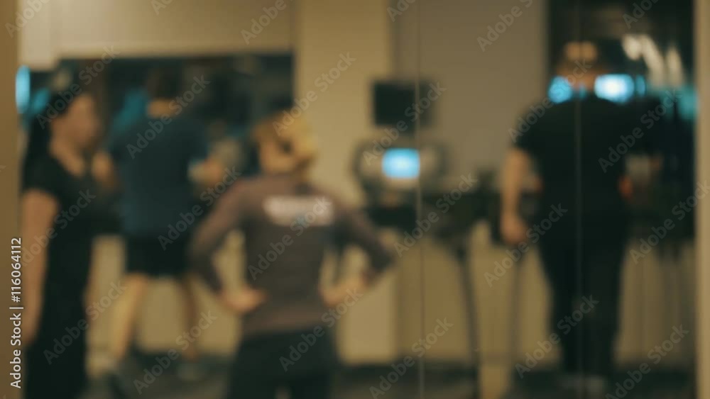 The members of the fitness club are training on treadmills and individually The members of the fitness club are training on treadmills and individually