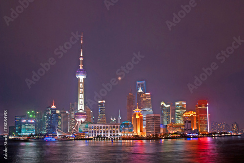 Night view of Pudong riverfront buildings and the pearl tower. one of the most famous tourist destinations in Shanghai.