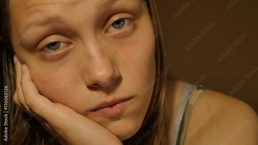 Sad teen girl thinking of something. 4K UHD Sad teen girl thinking of something. 4K UHD