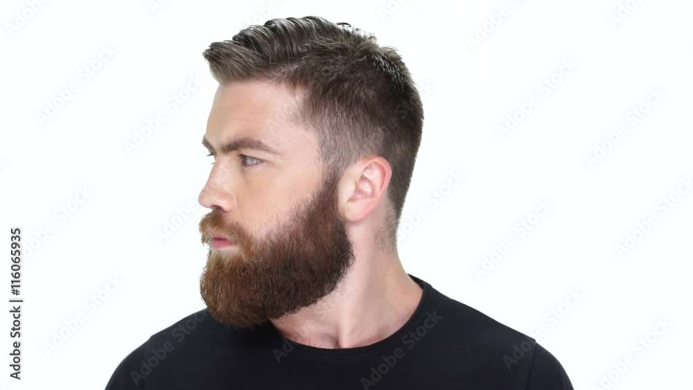Young handsome bearded man moves his head right and left Young handsome bearded man moves his head right and left