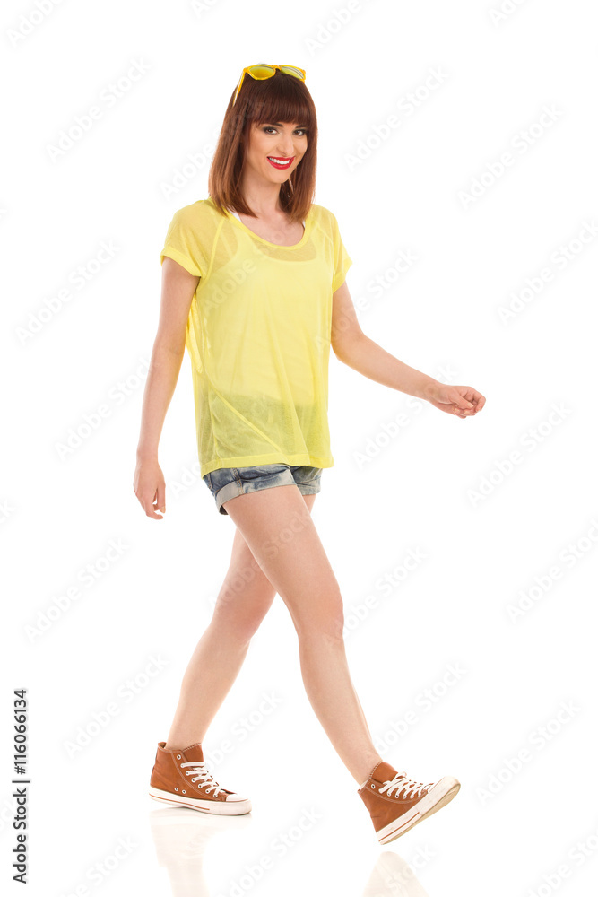 Fototapeta premium Woman Walks In Brown Sneakers