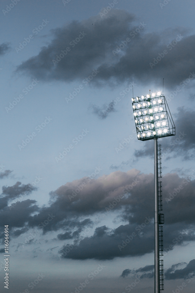 Naklejka premium stadium lights and overcast sky