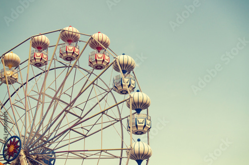 Ferris wheel on sky background intage effect image photo