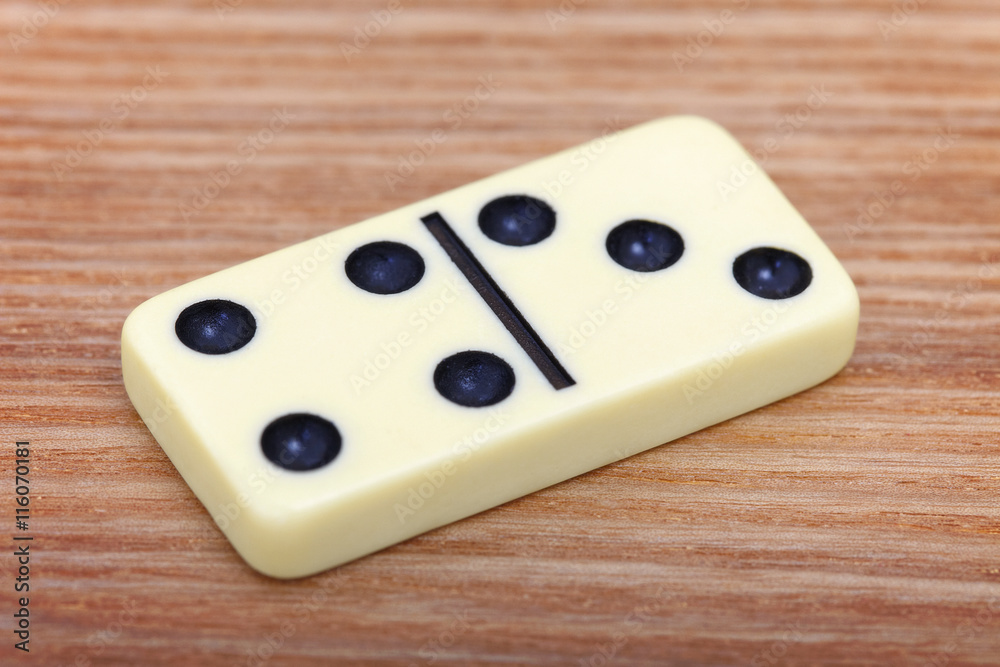 Dominoes on wooden surface close up Dominoes on wooden surface close up