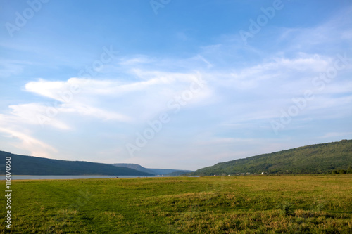 Landscape field of grass and cloud with blue sky