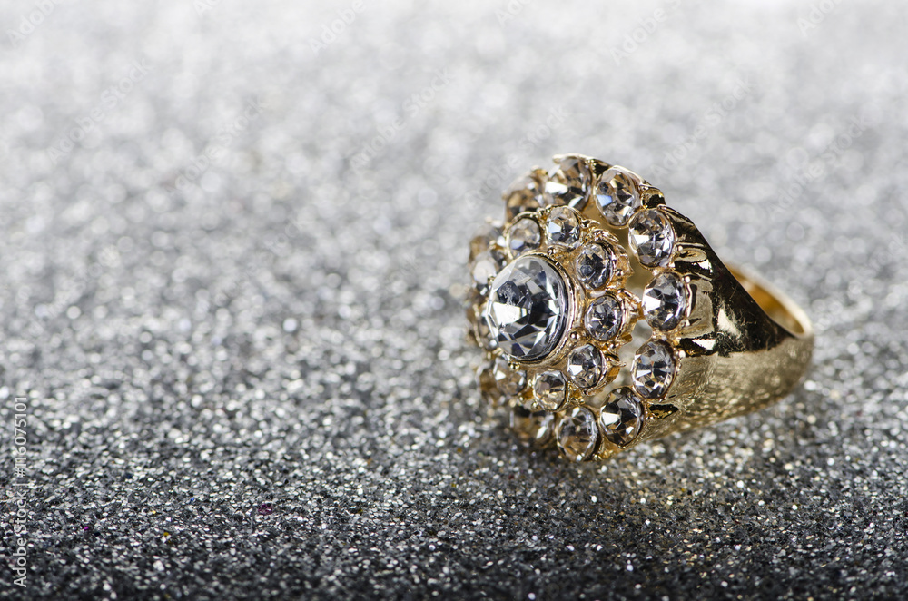 Jewellery ring against shiny background Jewellery ring against shiny background