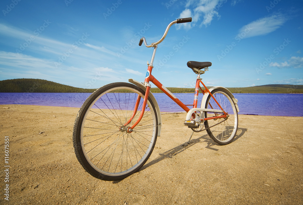Fototapeta premium Old-fashioned bicycle on summer beach