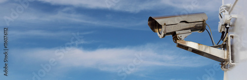 security camera panorama with blue cloudy sky photo