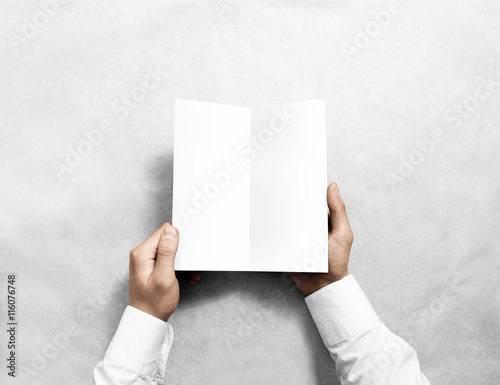 Hand opening blank white flyer brochure booklet mockup. Leaflet presentation. Pamphlet mock up holding hand. Man show clear offset paper. Booklet design template. Paper sheet display read first person