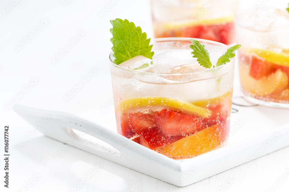 refreshing lemonade with strawberry and lemon on white tray refreshing lemonade with strawberry and lemon on white tray