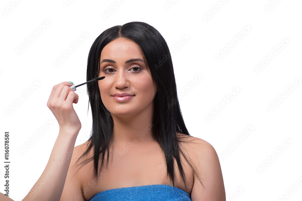 Young woman getting make-up isolated on white Young woman getting make-up isolated on white