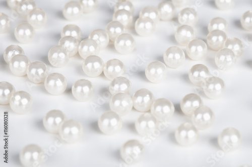 Fake pearls scattered on table