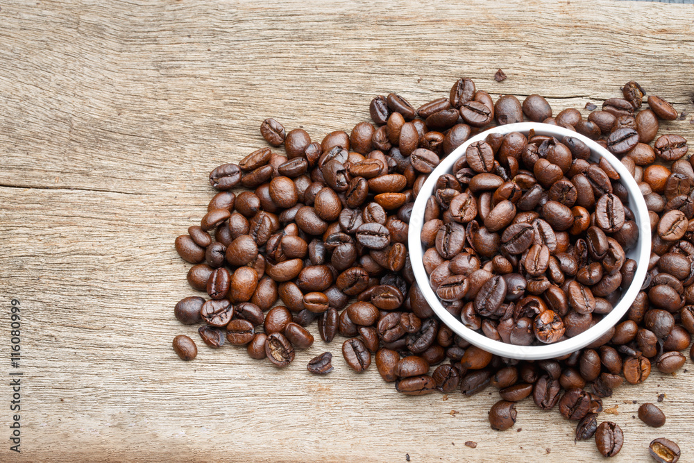 Coffee bean on the wooden floor Coffee bean on the wooden floor