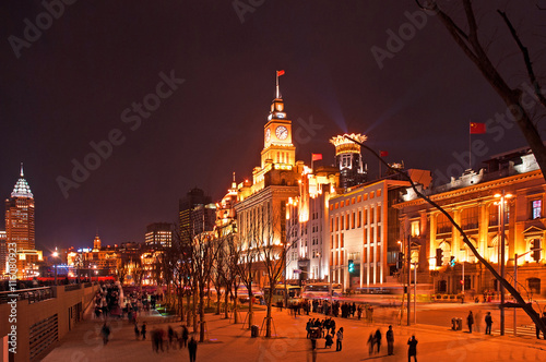 Night view of old buildings in the Bund, one of the most famous tourist destinations in Shanghai. photo