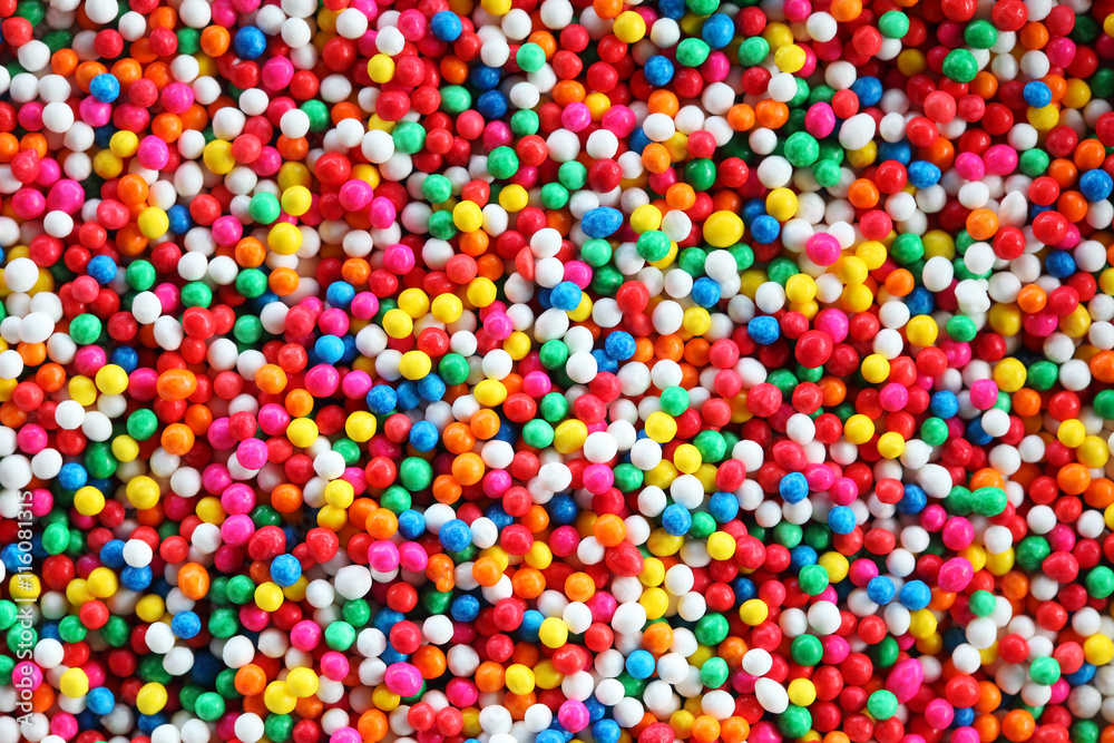 colorful sugar sprinkles background. colorful sugar sprinkles background.