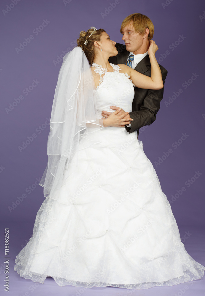 Bride and groom on purple background