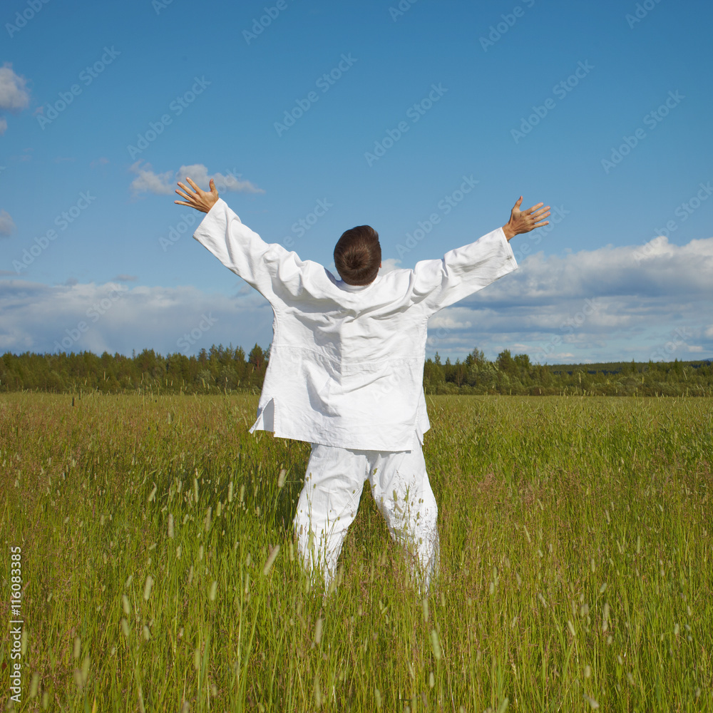 Man enjoys nature and fresh air in a field