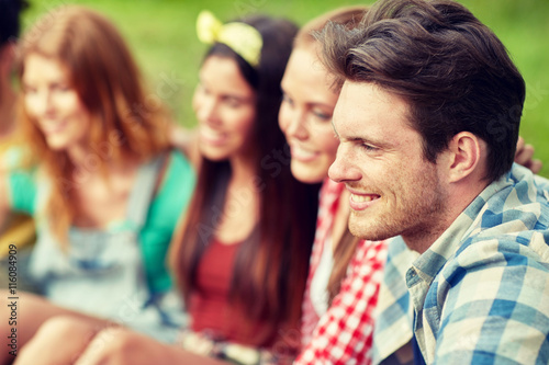 group of smiling friends outdoors