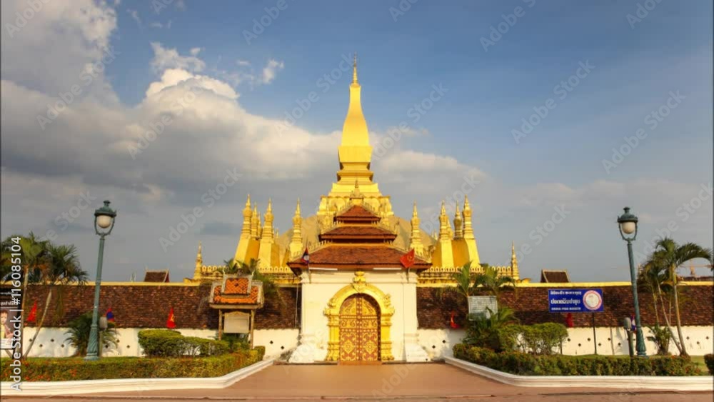 Timelapse cloud flowing outside view of Pha That Luang stupa with cloud flowing in Vientiane, Laos Timelapse cloud flowing outside view of Pha That Luang stupa with cloud flowing in Vientiane, Laos