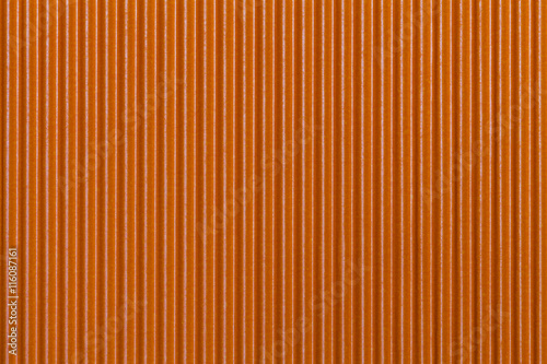 Texture corrugated orange paper. Striped background