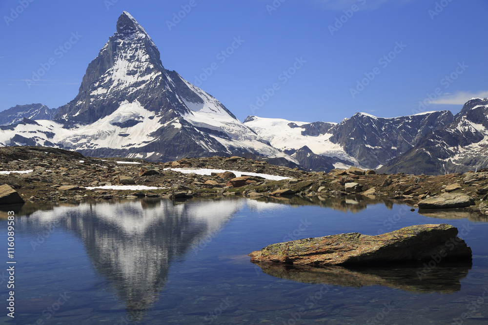 Matterhorn reflected into alpine lake, Switzerland