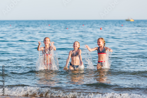 Happy kids on the beach © len44ik