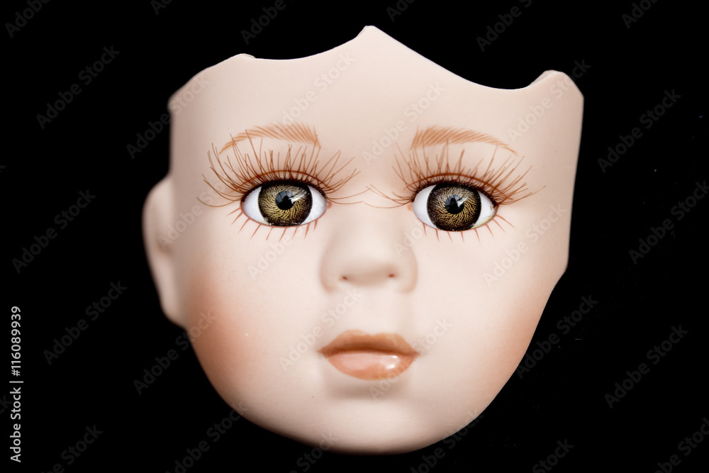 Broken Doll Face and Head on Black Background Broken Doll Face and Head on Black Background