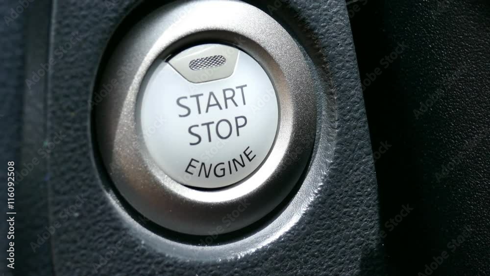 finger pressing start stop button in car automobile vehicle
finger pressing start stop button in car automobile vehicle