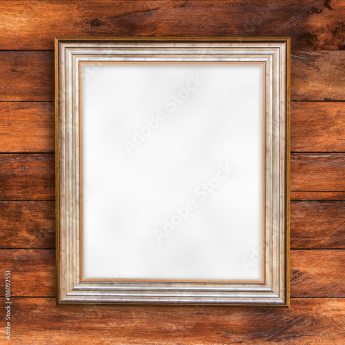 Blank of photo frame on wood wall background.
