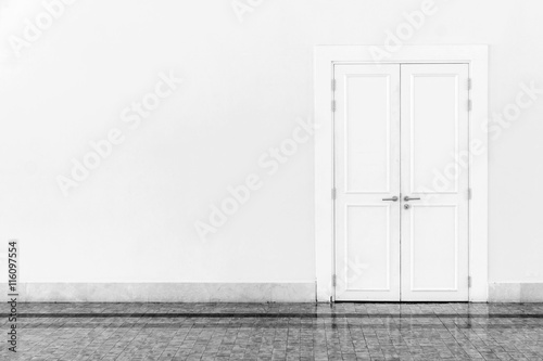 Vintage white door on marble ceramic tile floor