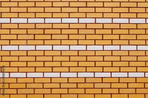wall of yellow and white ceramic brick.