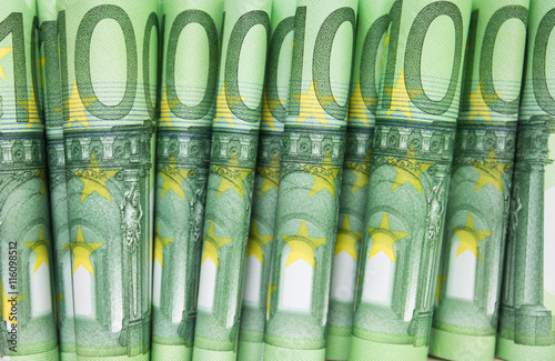 stacked one hundred euro bills , european money