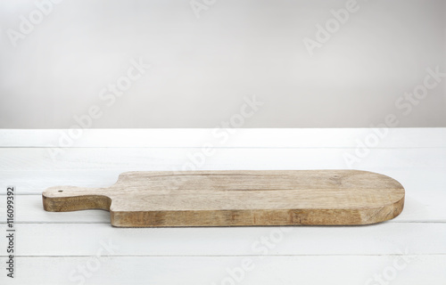 Fototapeta Naklejka Na Ścianę i Meble -  Empty cheeseboard on white wooden table.