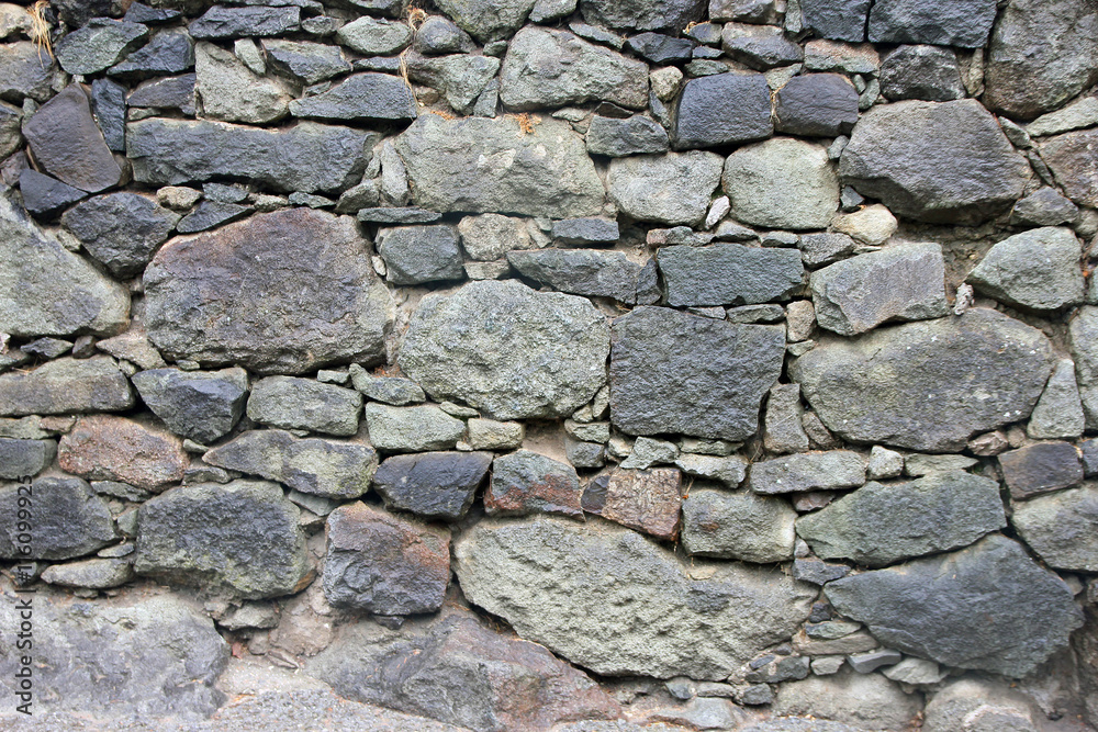 stone masonry wall from old dilapidated shabby rubble from big l
