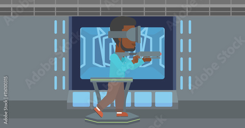 Man in virtual reality headset playing video game.