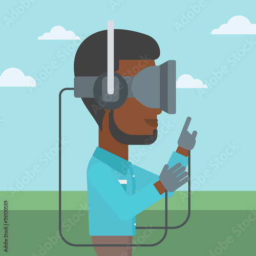 Man in virtual reality headset playing video game.