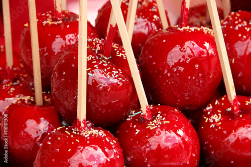 Sweet candy apples covered with colorful sprinkles