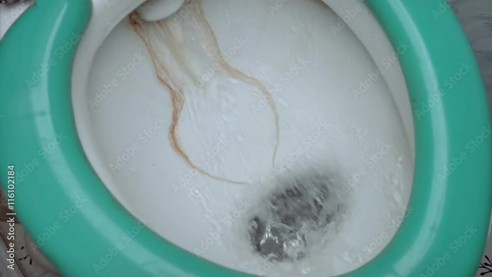 Flush old, untidy wc, water splash in toilet with green seat. Slow motion, high speed camera, 250fps Flush old, untidy wc, water splash in toilet with green seat. Slow motion, high speed camera, 250fps
