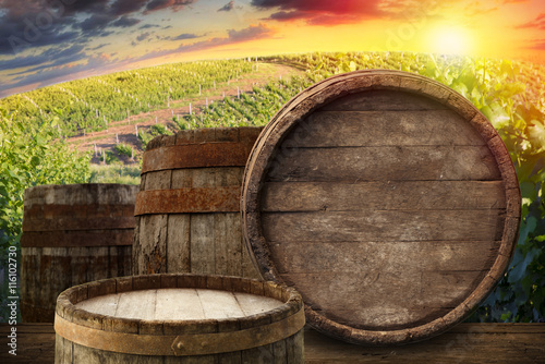 Red wine with barrel on vineyard in green Tuscany  Italy