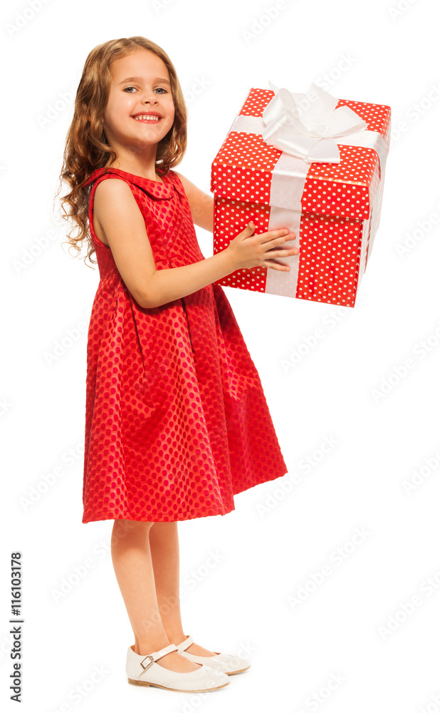 Little girl with huge birthday present isolated Little girl with huge birthday present isolated
