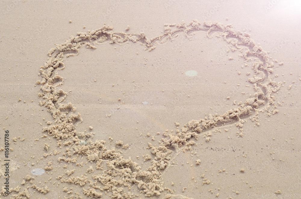 Heart on the sand, the view from the top, a symbol of love. Heart on the sand, the view from the top, a symbol of love.