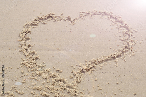 Heart on the sand, the view from the top, a symbol of love.